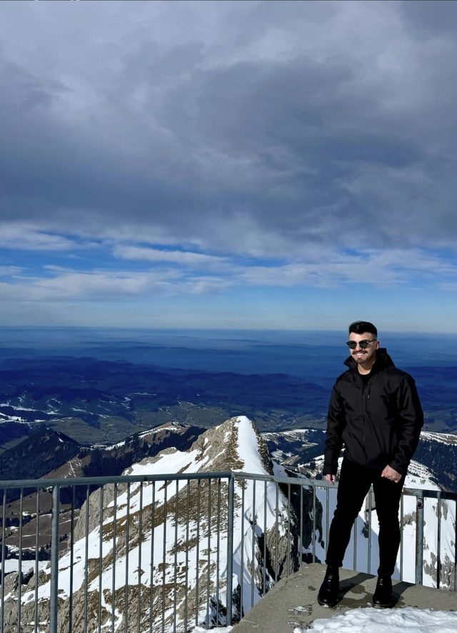 Louie at a snowy mountain overlook in the Swiss Alps